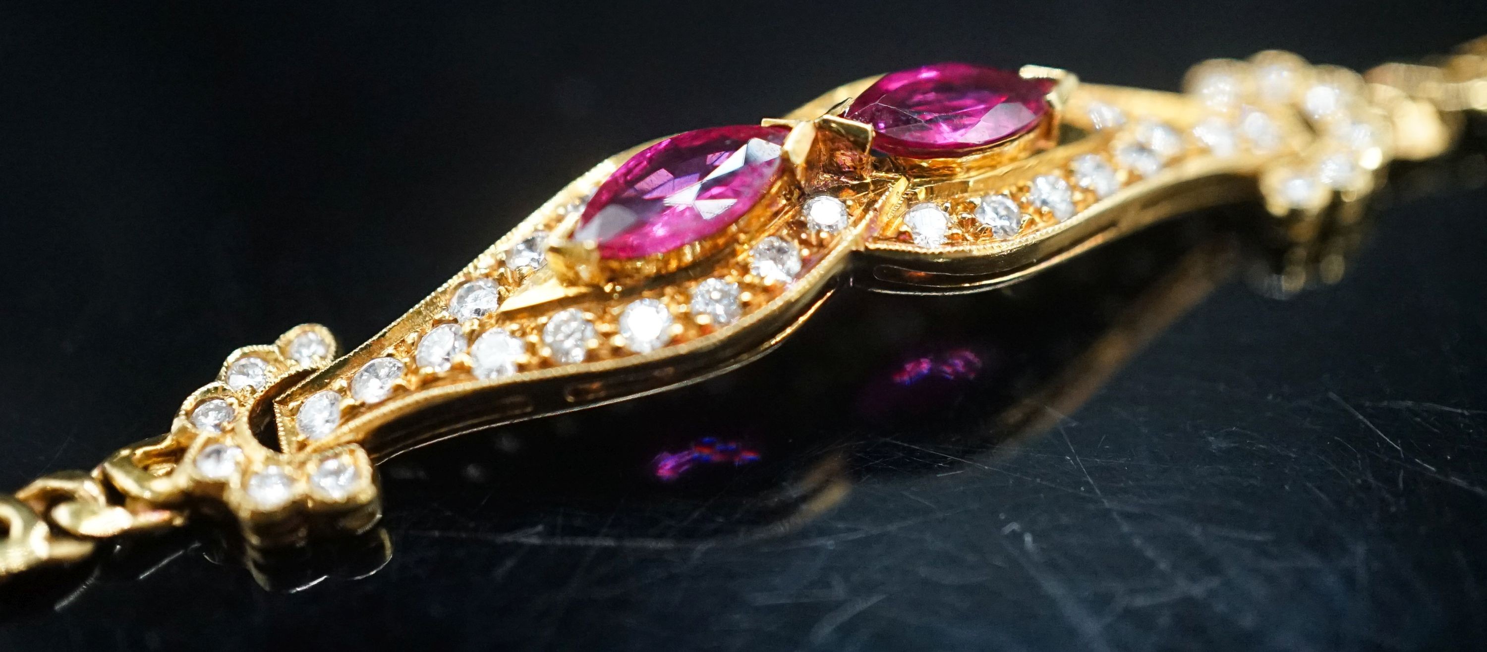 A lady's modern 18k, ruby and diamond set bracelet, 16cm, gross weight 9.2 grams.